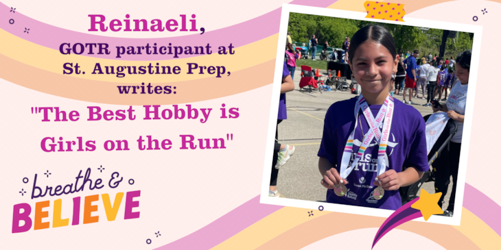 Reinaeli, GOTR participant, holds up her 5K medal with a smile.